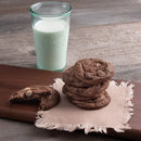 stack of chocolate cookies and a glass of milk