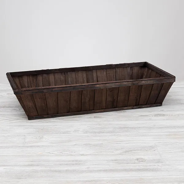 wooden rectangular basket on a white surface