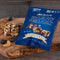 a blue bag of nuts and blueberries on a wood cutting board