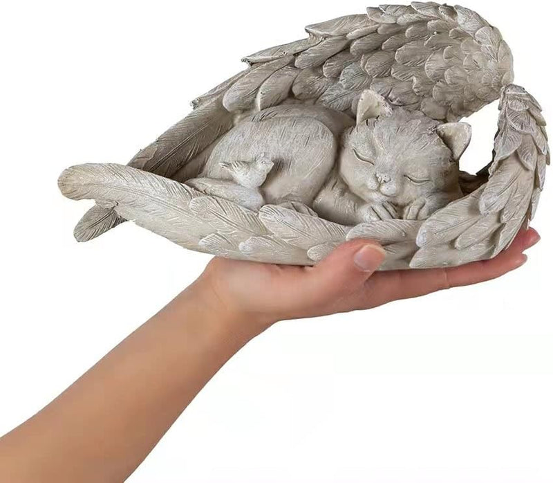 a hand holding a statue of a cat